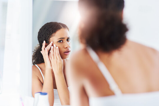 Woman, skincare and pimple acne in mirror reflection or dermatology problem, squeezing or morning. Female person, hands and popping in home with blackhead breakout with hygiene, unhappy or stress