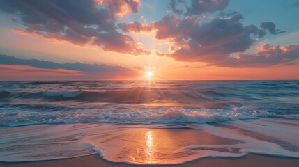 A beautiful sunset over the ocean, with waves crashing against the shore and vibrant colors in the sky.
