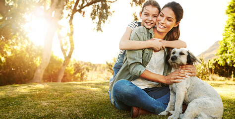 Mother, daughter and playing with dog in park for bonding, relax and happy with fun activity in...