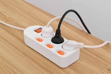 Electrical plug in outlet socket at home isolated on on wooden table, Outlet, Electric Plug, Power...