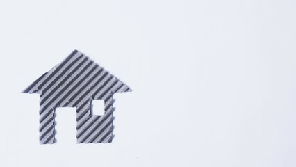 House and tree  made of cardboard on a white background. Children creativity art project. DIY concept. Cardboard craft. Copy space