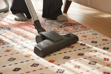 women cleaning with vacuum cleaner carpet,