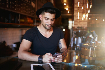 Phone, coffee shop and man in cafe with tablet for small business, stock inventory and store website. Restaurant, hospitality and owner by counter on digital tech for orders, online and social media