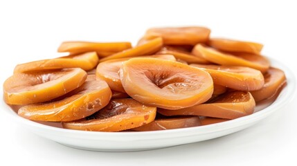 Plate of sliced, caramelized persimmons on a white background, perfect for desserts or gourmet recipes. Fresh and appetizing.