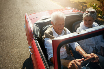 Senior, couple and driving convertible for road trip holiday or countryside retirement,...