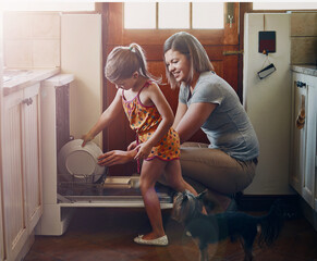 Dishwasher, mother and child cleaning in home kitchen for hygiene, housework and learning. Mom, kid...