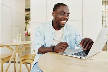Computer young african modern person technology adult men male laptop black sitting business happy