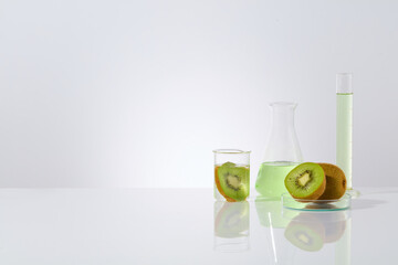 Frontal shot photo of kiwi in laboratory theme, some fresh kiwi placed in petri dish and beaker, a...