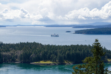 A BC ferry approaches active pass of the southern gulf island of BC Canada