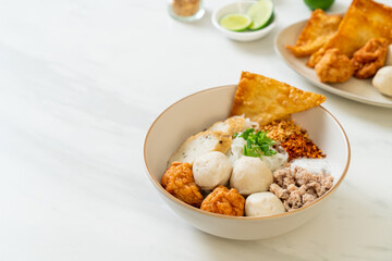 spicy small flat rice noodles with fish balls and shrimp balls without soup