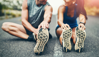 Fitness, health and couple for stretch before running training outdoor on street for marathon...