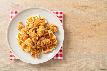 fried chicken waffle with honey or maple syrup