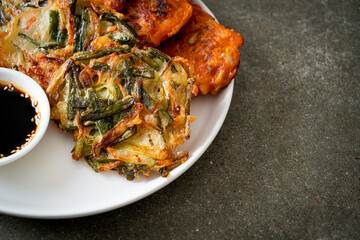 Pajeon or Korean pancake and Korean Kimchi pancake or Kimchijeon on white background