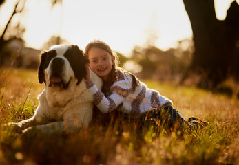 Portrait of girl, dog and love with hug in park for affection, friendship or cuddle pet in nature....