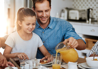Happy, girl and dad together with breakfast on table for nutrition, eating or sharing. Hungry, man and kid in home excited for meal, drink and wellness on social morning with healthy food and juice