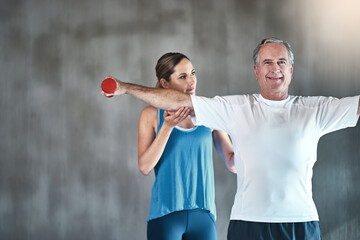 Senior man, dumbbells and help with woman in gym for physiotherapy, stretching arms and...