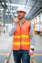 Portrait of a confident engineer in a train maintenance center