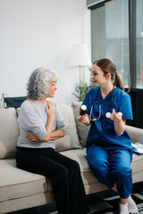 Doctors explain the use of medication to patients. Medical doctor holing senior patient's hands and...