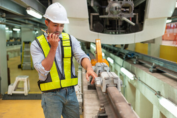 Engineers check the readiness of electric train tracks at the maintenance factory.