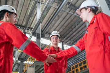 Industrial Team Greeting Each Other in Manufacturing Plant