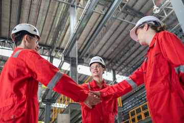 Industrial Team Greeting Each Other in Manufacturing Plant