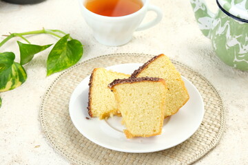 Classic Vanilla Sponge Cake with chocolate sprinkles as topping - (Bolu Jadul) on white background.