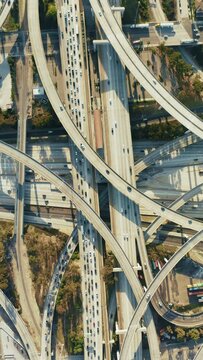 Bird's-eye view of the bustling Judge Harry Pregerson Interchange, featuring the I-105 and I-110 freeway crossing. 4K footage. 