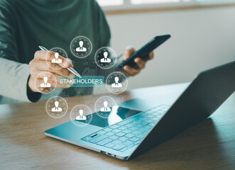 Stakeholders concept. Person touching stakeholders icon on virtual screen for business finance stakeholder investment management. Different stakeholders contact collaboration for company organization