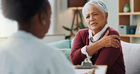 Senior, woman and doctor with consultation for shoulder pain with injury, explaining symptoms and medical checklist. Elderly patient, nurse and discussion in nursing home, osteoporosis and rear view