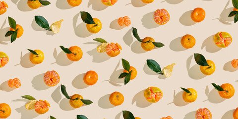 Fresh juicy orange yellow tangerines as minimal flat lay pattern, Sweet Citrus fruits with green...