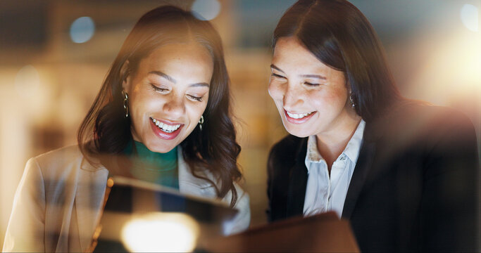 Laptop, tablet and collaboration with business people at night in the office together for teamwork. Technology, smile and a happy employee team of women working on a project or report in the evening - Powered by Adobe