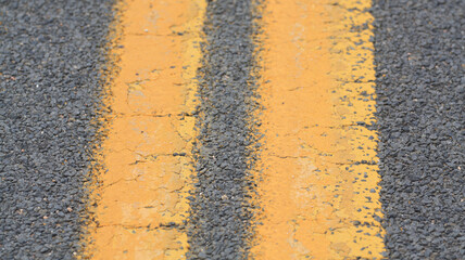 Close up double yellow lines on a street