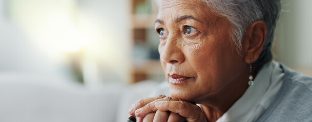 Elderly woman, closeup and thinking with cane for mental health, retirement and healthcare at nursing home. Senior person with disability, walking stick and sad on sofa for arthritis or dementia