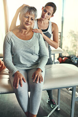 Physiotherapist, senior woman and neck pain treatment fr rehabilitation recovery, consultation or...