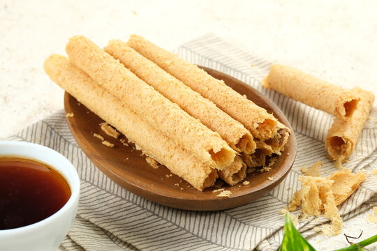 Egg Roll Biscuit or Kue Semprong or sapit, Simping, kue Belanda, or kapit or Love letters in English. It is an Indonesian traditional wafer snack