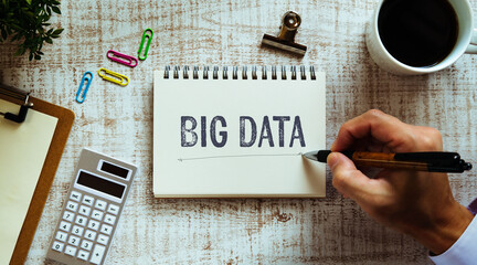 There is notebook with the word Big Data. It is as an eye-catching image.