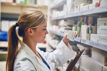 Woman, pharmacist or reading boxes for stock check or inventory at pharmacy for pills information....