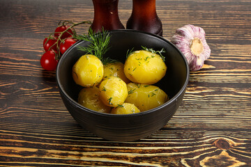 Boiled potato with oil and dill