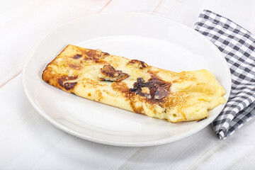 Sweet pancake with banana and honey