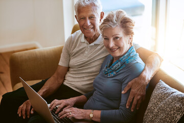 Happy senior couple, portrait and sofa with laptop for browsing, online shopping or finance at...