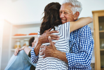 Elderly, father and woman hug in home with love, care and support in retirement from family....