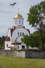 Orthodox church and flying stork