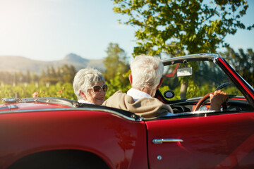 Old couple, road trip and convertible car countryside driving in vineyard or retirement travel,...