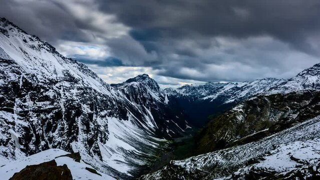 Beautiful timelapse of snow cladded mountain tops with clouds flying over in Rupin pass trek, Uttrakhand, India