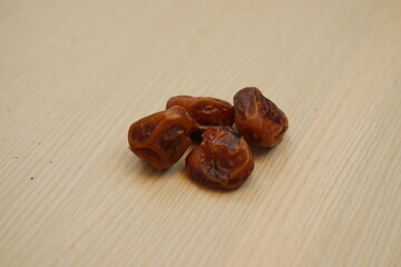 Dates fruit on wooden background. Healthy eating and dieting concept.