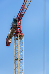 Construction Crane Detail On Blue Sky Background Close-up