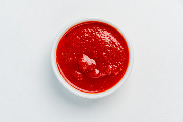 bowl of red tomato sauce ketchup Isolated on white