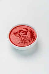 bowl of red tomato sauce ketchup Isolated on white