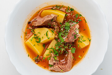 soup with veal on white background
