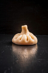 Khinkali - Georgian traditional food. black background